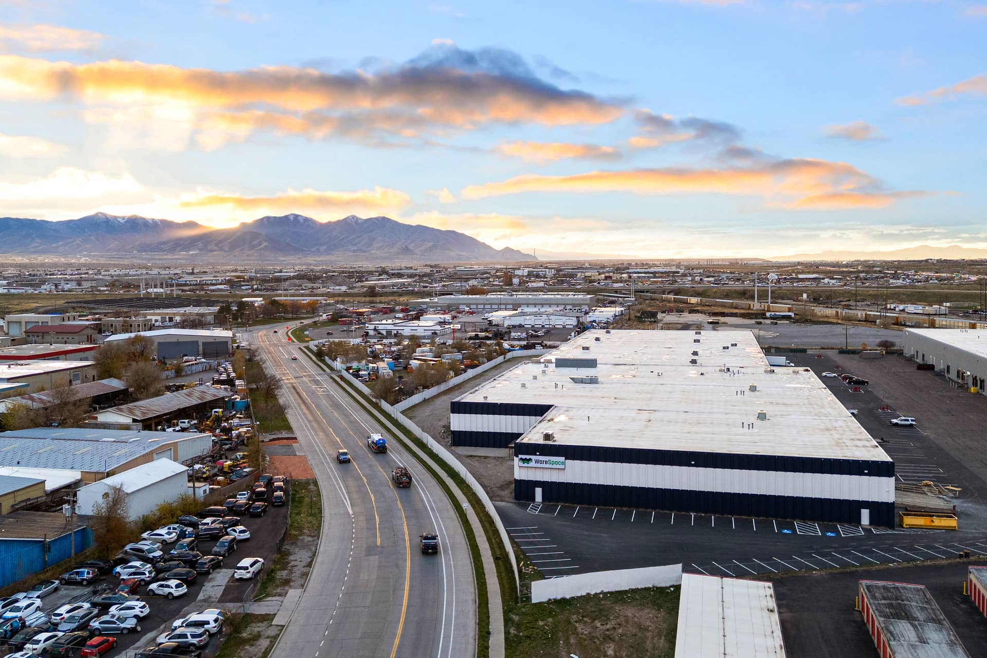 Fortdelis Pharma's gated warehouse facility with the Wasatch mountains behind it